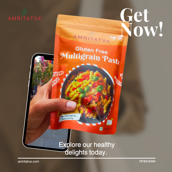 Amritatva gluten-free multigrain pasta package held by a hand with blurred background